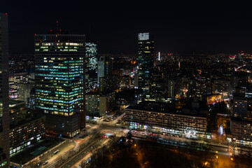 Fototapeta na wymiar Warsaw center at night skyline with skyscrapers and lights