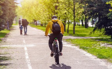 Fototapeta premium Cyclist ride on the bike path in the city Park 