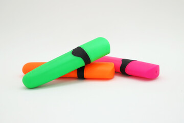 School and office supplies. Highlighter fibers in fluorescent colors. Bright colored fibers on white background isolated. Tools for students and office workers.