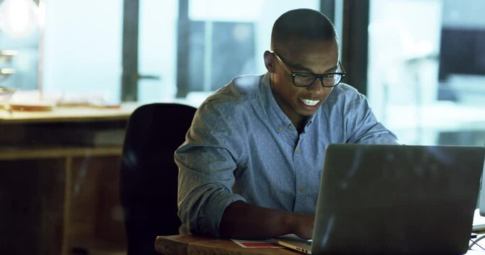 Happy business man, laptop and night in office with typing, project and overtime for goal, deadline or company mission. Black businessman, computer and smile with web design, proposal and startup job