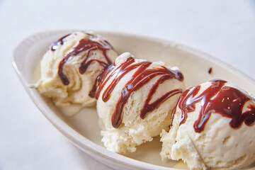 Ice cream dessert sugar sweet premium dark milk chocolate swirl on top plain background