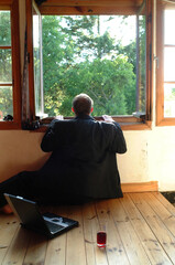 man sitting on the window