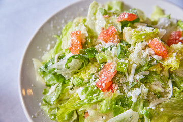 House side salad iceberg lettuce white cheese tomato chunks white plate background asset