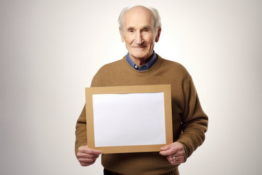 Portrait of senior man holding a blank card with copy space for your text