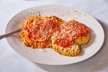 Baked chicken mozzarella Italian food dish meal lunch dinner parsley lined white plate background