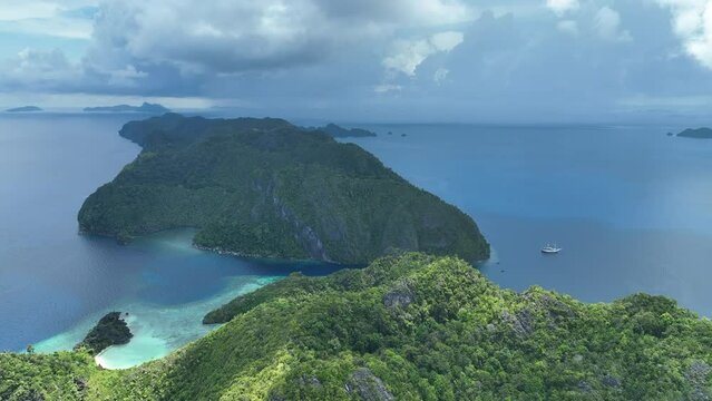 Rain falls on the sea surrounding islands in Raja Ampat's dramatic seascape. This part of Indonesia is known for its amazing scenery and incredibly high marine biodiversity.