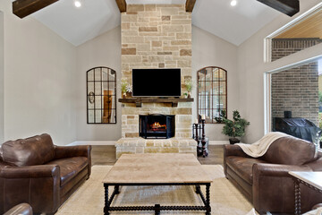 luxury living room with a fireplace