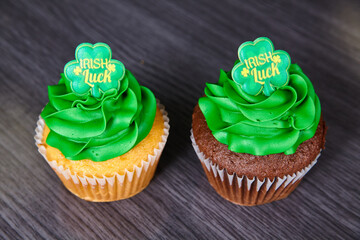 Vanilla and chocolate St. Patrick’s Day cupcakes green frosting Irish Luck four-leaf clover topper