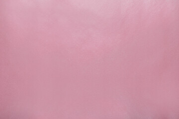 Pink wrapping paper as background, top view