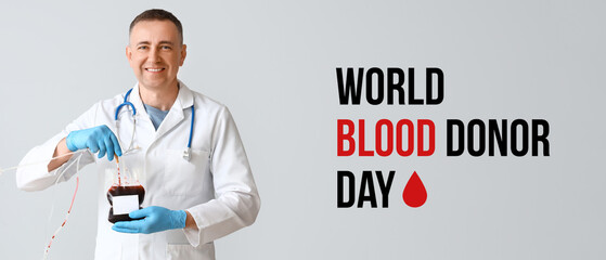 Banner for World Blood Donor Day with mature doctor