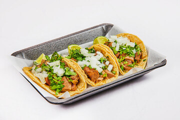 Three cow tongue street tacos on white background asset