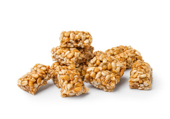 Pieces of sweet kozinaki on white background