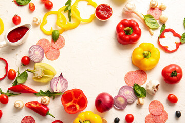 Frame made of ingredients for preparing pizza on white background