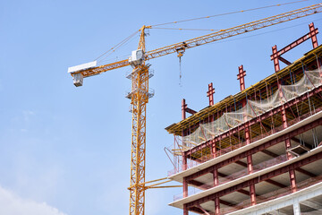 Crane during formworks. Housing renovation concept. View of a large construction site with...
