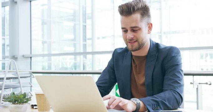 Happy business man typing on laptop in office for planning, online research and email update at desk. Male analyst, computer and smile for website connection, internet trading or technology