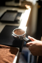 Closeup of a barista making a coffee in a coffee shop