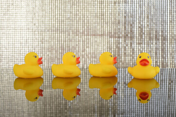 The toy duck gazes in a different direction, embodying a sense of uniqueness, individuality, and embracing diverse creative ideas. The subtle misalignment sparks a delightful misunderstanding