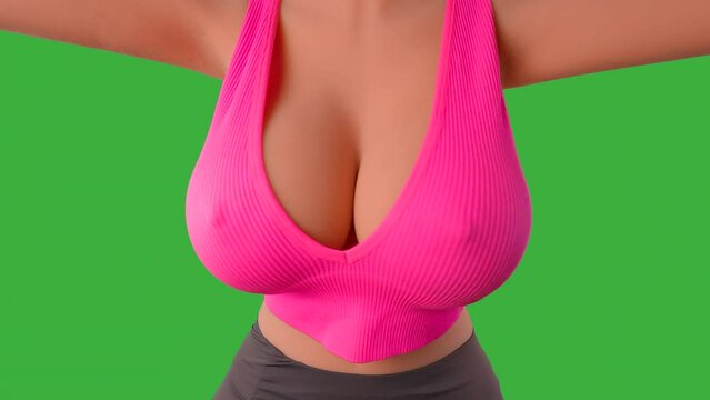 Beautiful large breasts jiggle as a sexy girl in sports gear reaches with her arms over the camera. A low-cut sports bra reveals cleavage. Upper body close-up. This is a doll, so no model release.
