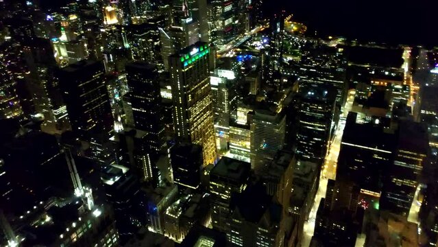 Dolly shot of Chicago at night. Aerial view of panning shot of Chicago at night