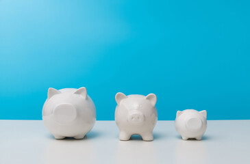 Three piggy banks on the table