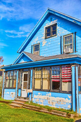 Blue house fading to white paint American flag green lawn blue sky texture background asset