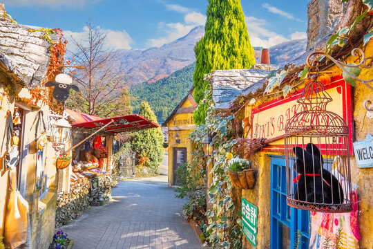 Yufuin, Japan - Nov 27 2022: Yufuin Floral Village is a theme park based on the Cotswolds area in England. The village fills with souvenir shops for tourist to do the shopping
