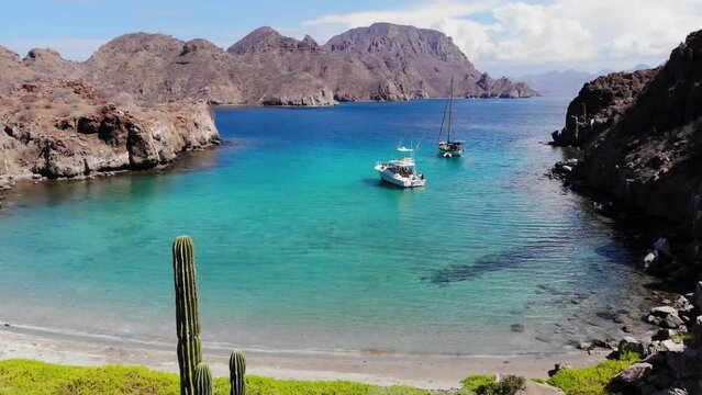 Beautiful bahia in Baja, Cortez Sea, Danzante Bay, Loreto, Blue ocean, Sunny day, one yatch and one sailboat, beautiful life near to Cabo San Lucas Mexico, Cactus, Beach, birds, different blue colors.