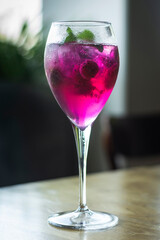 raspberry and red dragon fruit prosecco wine spritzer cocktail - 606269418