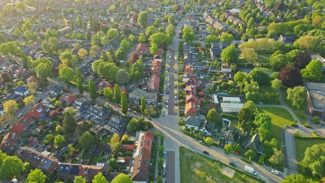 High aerial of beautiful green neighborhood at golden hour