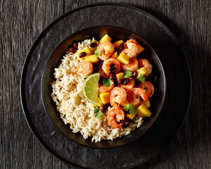shrimps with beans, mango, brown rice in bowl