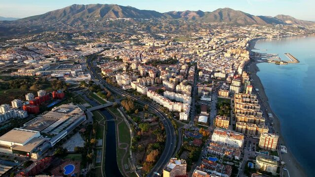 Aerial of a stunning, mountainous city by the sea - Fuengirola (Andalusia).