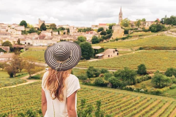 Foto op Plexiglas Rear view of woman looking at green vineyard in Bordeaux region, Saint Emilion- France, Nouvelle aquitaine © M.studio