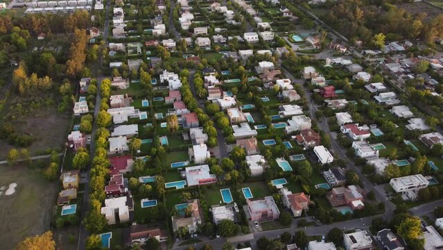 Aerial view of fancy neighborhood with luxury swimming pools in garden In noble district of Buenos Aires