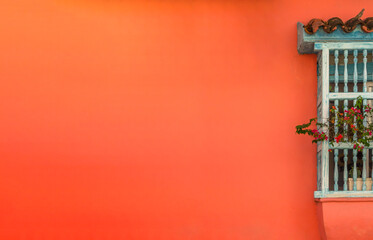Obraz premium Spanish Colonial Style Architecture. Window with Wooden Wrought and awning on Peach Red Wall.