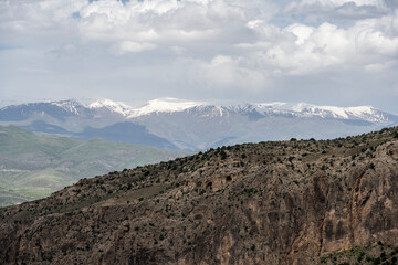mountain landscape in spring with flowering meadows against the sky