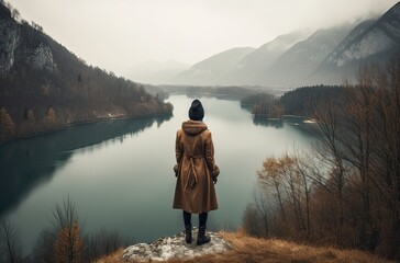 Mountaineer woman observes the views of a sunset on Lake. Generative Ai.