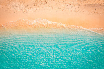 Summer seascape beautiful waves, blue sea water sunset light. Top view from drone. Seaside aerial...