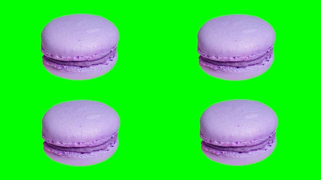 trendy food stop motion animation, sweet macarons cake of different colors on a green chroma key background in pop art style