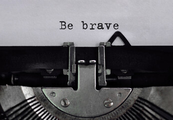 Text be brave typed on retro typewriter