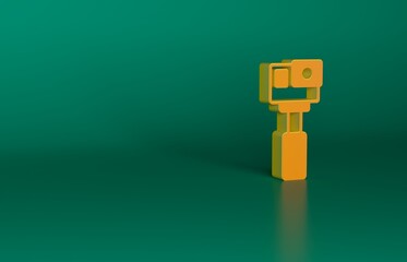 Orange Action extreme camera icon isolated on green background. Video camera equipment for filming extreme sports. Minimalism concept. 3D render illustration