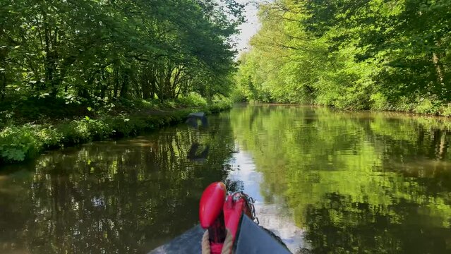 POV footage travelling along the Shropshire Union canal waterway on a narrowboat, or barge.