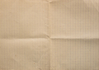 paper background - unfolded sheet of old squared paper from a mid-twentieth century notebook