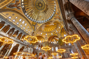 Fototapeta na wymiar St. Sophia mosque interior dome and lamps. Historic Istanbul, Turkey
