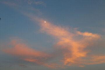 Sunset sky, clouds, and moon