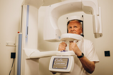 Patient in a hospital MRI scanner. Woman lays in Magnetic resonance image device. Woman patient is...