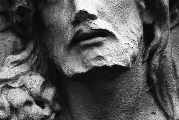 Fototapeta na wymiar Fragment of an ancient statue of Jesus Сhrist