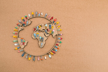 World Population Day, creative concept. Large and diverse group of people in the shape of the world...