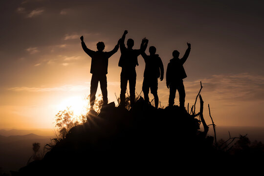 the silhouette of a group of people standing on a mountain top
