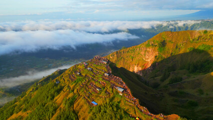 Mount Batur. Mount Batur is an active volcano located at the center of two concentric calderas north west of Mount Agung on the island of Bali, Indonesia.	