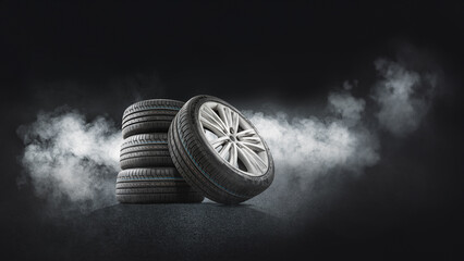 Tire shop, car service and car wheel tire shop design. Stack of car black rubber tires advertising banner - Illuminates asphalt, smoke. - obrazy, fototapety, plakaty